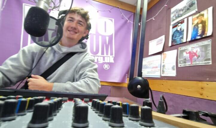 joel at the mixing desk in the radio studio